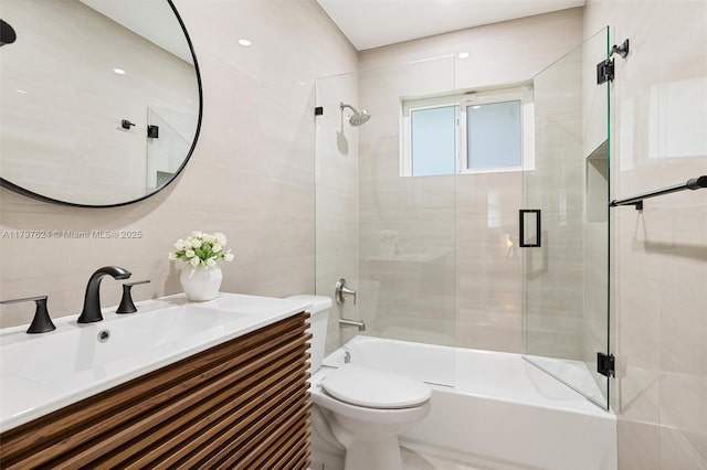 950 NE 88th St, Miami, FL 33138 - full bathroom featuring toilet, combined bath / shower with glass door, vanity, and tile walls