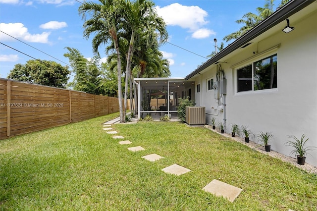 950 NE 88th St, Miami, FL 33138 - view of yard with a sunroom and central AC