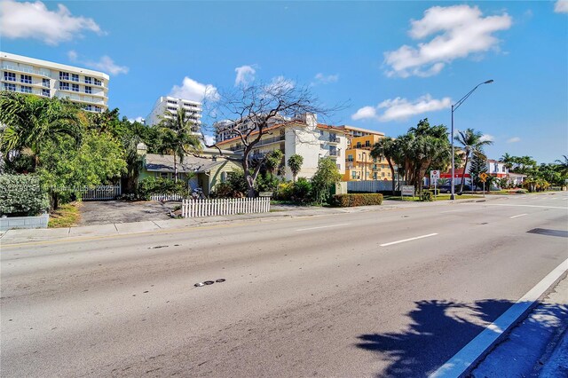 8919 Harding Ave, Surfside, FL 33154 - view of asphalt street with street lights, curbs, and sidewalks