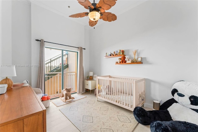 140 Jefferson Ave Unit 14020, Miami Beach, FL 33139 - bedroom featuring crown molding, light wood finished floors, access to exterior, and a ceiling fan