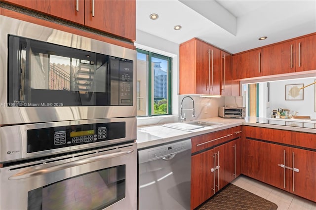 140 Jefferson Ave Unit 14020, Miami Beach, FL 33139 - kitchen featuring appliances with stainless steel finishes, a sink, recessed lighting, decorative backsplash, and light tile patterned floors