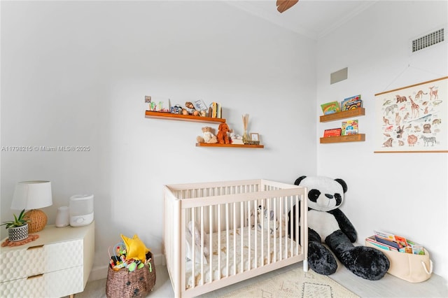 140 Jefferson Ave Unit 14020, Miami Beach, FL 33139 - bedroom with a crib and ornamental molding