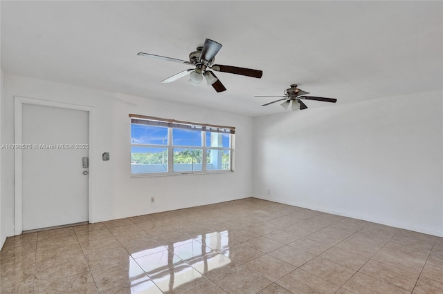 2840 NE 14th St Cswy Unit 408A, Pompano Beach, FL 33062 - spare room with tile patterned flooring, ceiling fan, and baseboards