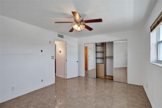 2840 NE 14th St Cswy Unit 408A, Pompano Beach, FL 33062 - unfurnished bedroom featuring a closet, baseboards, and a ceiling fan
