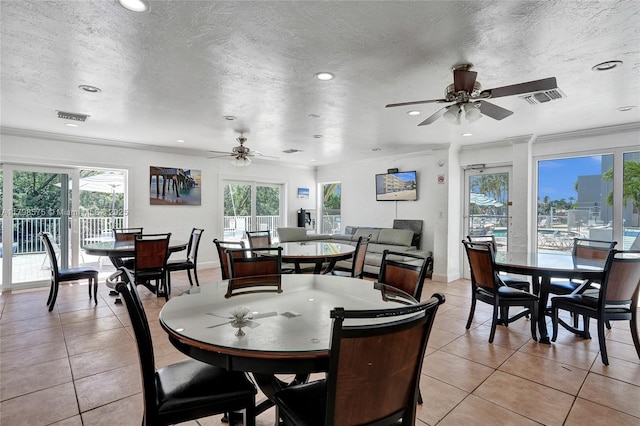2840 NE 14th St Cswy Unit 408A, Pompano Beach, FL 33062 - dining space with plenty of natural light, ceiling fan, light tile patterned flooring, crown molding, and recessed lighting