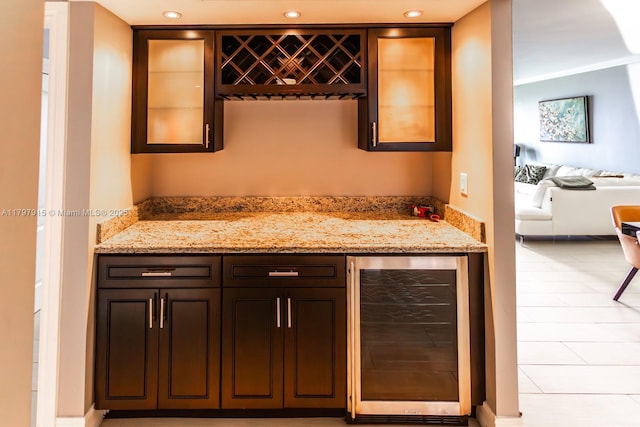 indoor dry bar with wine cooler and recessed lighting