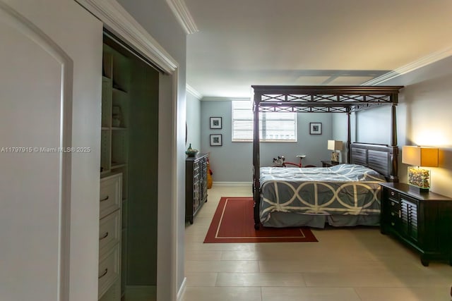 bedroom featuring crown molding and baseboards