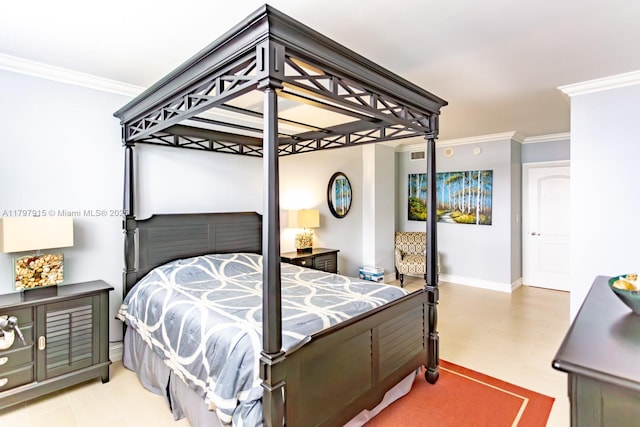bedroom with ornamental molding, baseboards, and light flooring