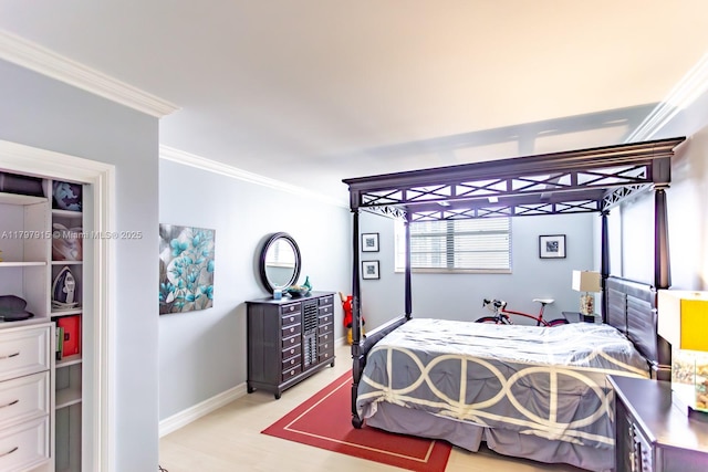 bedroom with crown molding and baseboards