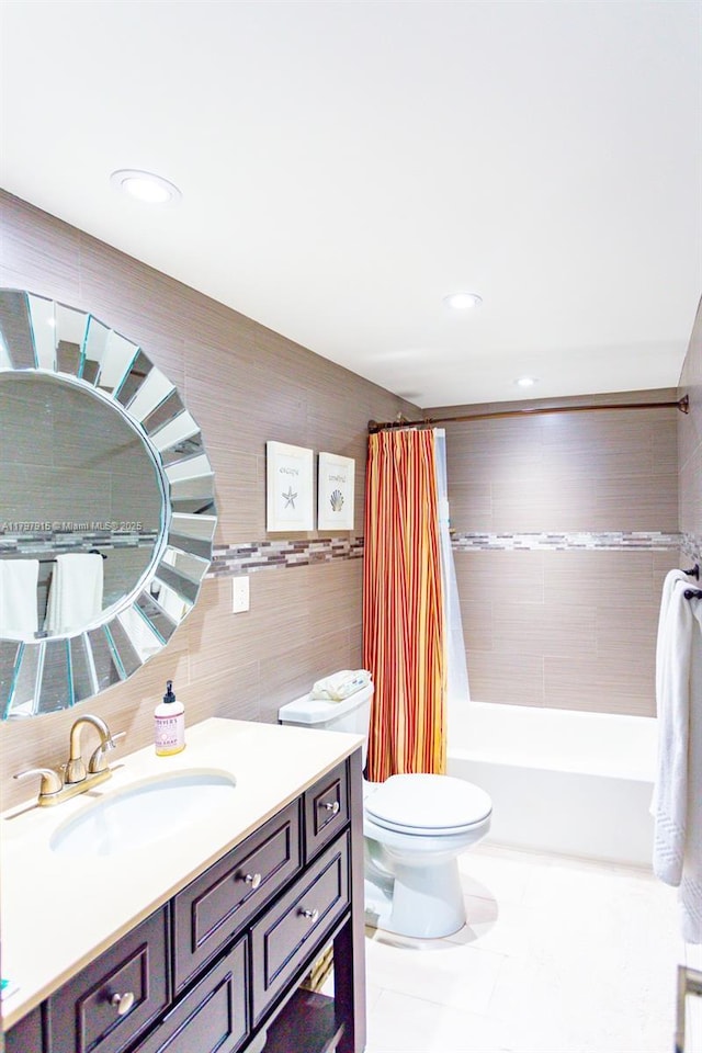 bathroom with tile walls, toilet, vanity, shower / bath combination with curtain, and recessed lighting