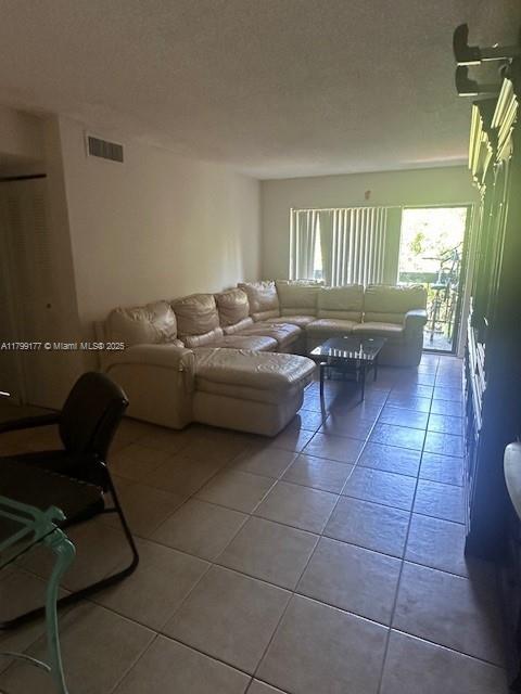 1900 N Congress Ave Unit 305, West Palm Beach, FL 33401 - living area with tile patterned flooring