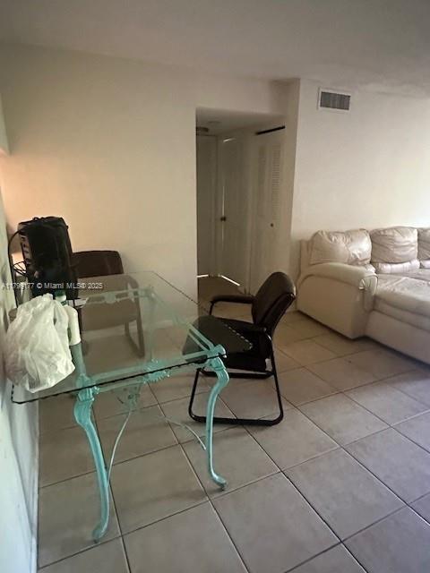 1900 N Congress Ave Unit 305, West Palm Beach, FL 33401 - dining room with light tile patterned floors