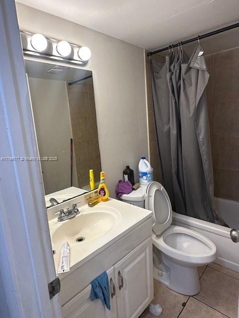1900 N Congress Ave Unit 305, West Palm Beach, FL 33401 - bathroom with tile patterned floors, vanity, shower / tub combo, and toilet