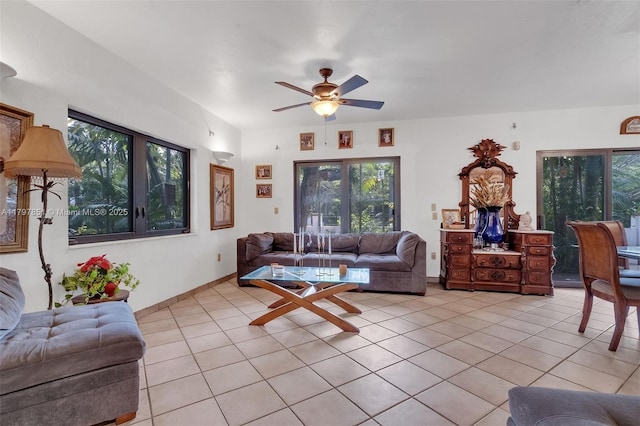 1226 Cordova St, Coral Gables, FL 33134 - living room featuring light tile patterned flooring, ceiling fan, and healthy amount of natural light