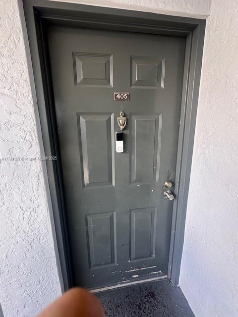1820 N Congress Ave Unit 405, West Palm Beach, FL 33401 - property entrance featuring stucco siding