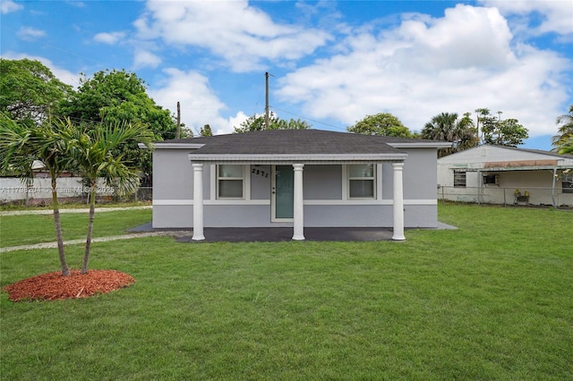 2571 NW 139th St, Opa-Locka, FL 33054 - view of front of house featuring stucco siding, a porch, and roof with shingles
