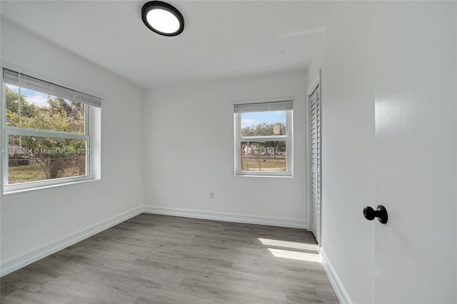 2571 NW 139th St, Opa-Locka, FL 33054 - unfurnished room with wood finished floors and baseboards