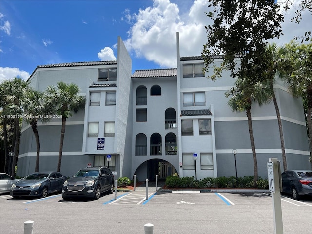 2000 N Congress Ave Unit 411, West Palm Beach, FL 33401 - view of building exterior with uncovered parking