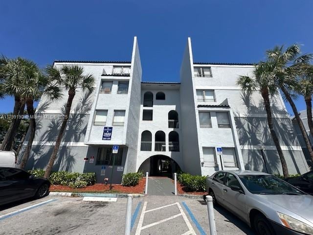 2000 N Congress Ave Unit 411, West Palm Beach, FL 33401 - view of building exterior with uncovered parking