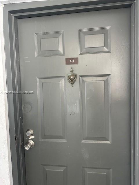 2000 N Congress Ave Unit 411, West Palm Beach, FL 33401 - view of exterior entry featuring stucco siding