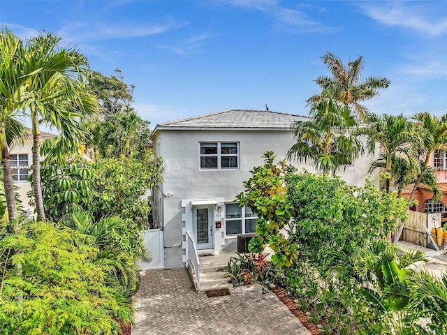 729 85th St, Miami Beach, FL 33141 - view of front facade with stucco siding and fence