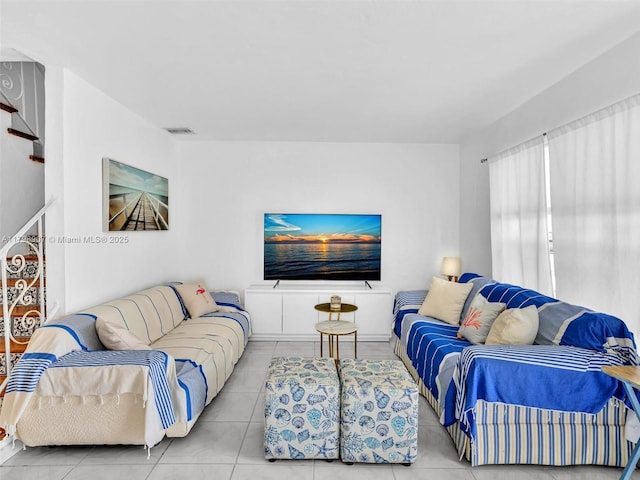 729 85th St, Miami Beach, FL 33141 - living room featuring tile patterned floors and stairway