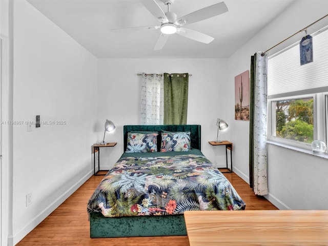 729 85th St, Miami Beach, FL 33141 - bedroom featuring wood finished floors, baseboards, and a ceiling fan