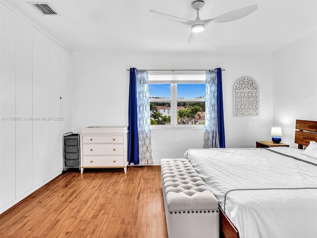 729 85th St, Miami Beach, FL 33141 - bedroom with light wood-type flooring and a ceiling fan