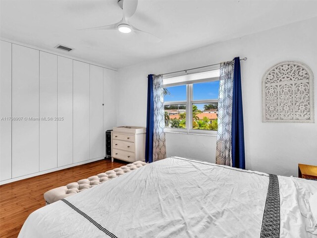 729 85th St, Miami Beach, FL 33141 - bedroom with wood finished floors and a ceiling fan