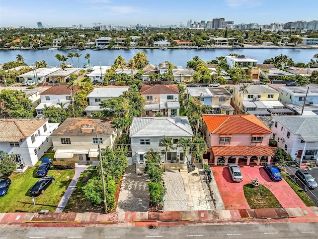 729 85th St, Miami Beach, FL 33141 - aerial view of residential area featuring a large body of water, property parcel outlined, and a view of skyline