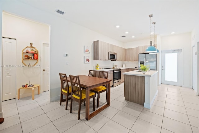 dining room featuring light tile patterned floors, recessed lighting, and baseboards