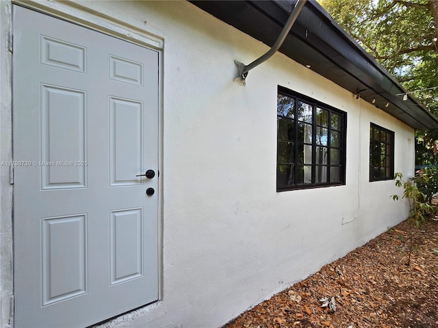 view of property exterior with stucco siding