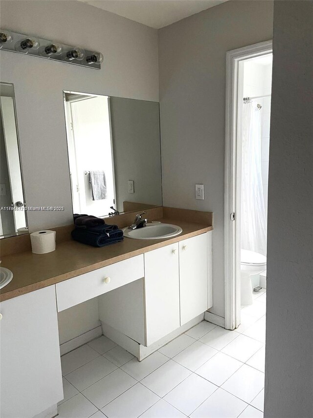 20441 NW 15th Ave Unit 8, Miami Gardens, FL 33169 - full bath with tile patterned floors, vanity, and toilet