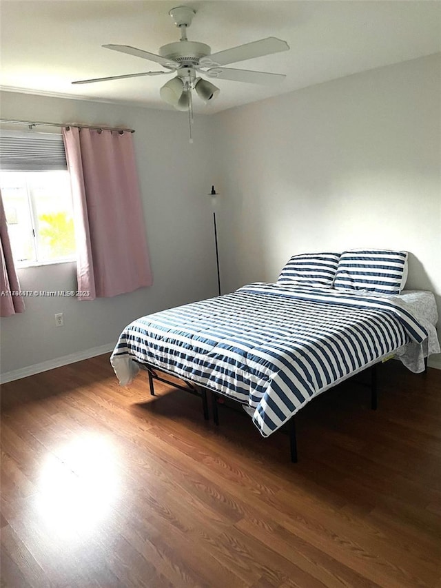 20441 NW 15th Ave Unit 8, Miami Gardens, FL 33169 - bedroom featuring wood finished floors, baseboards, and a ceiling fan