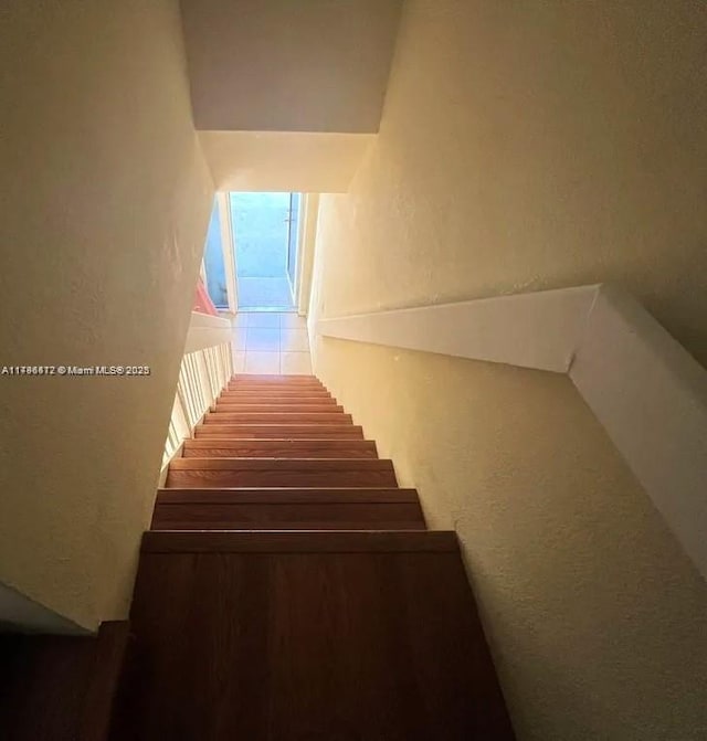 20441 NW 15th Ave Unit 8, Miami Gardens, FL 33169 - stairway with a textured wall