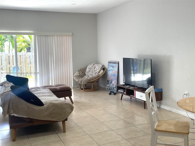 20441 NW 15th Ave Unit 8, Miami Gardens, FL 33169 - living room with light tile patterned floors and baseboards