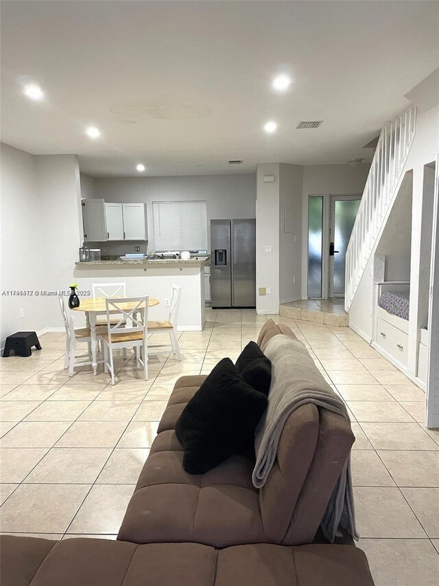 20441 NW 15th Ave Unit 8, Miami Gardens, FL 33169 - living area featuring light tile patterned floors, recessed lighting, and baseboards