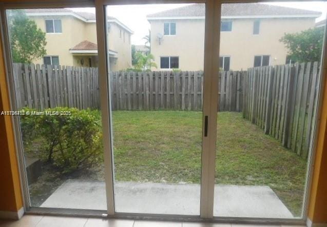 20441 NW 15th Ave Unit 8, Miami Gardens, FL 33169 - doorway with tile patterned floors