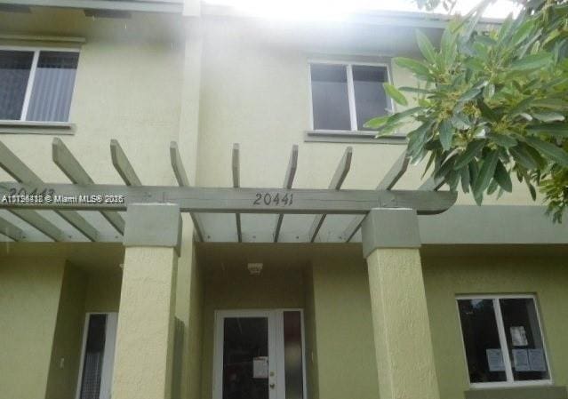 20441 NW 15th Ave Unit 8, Miami Gardens, FL 33169 - property entrance with stucco siding