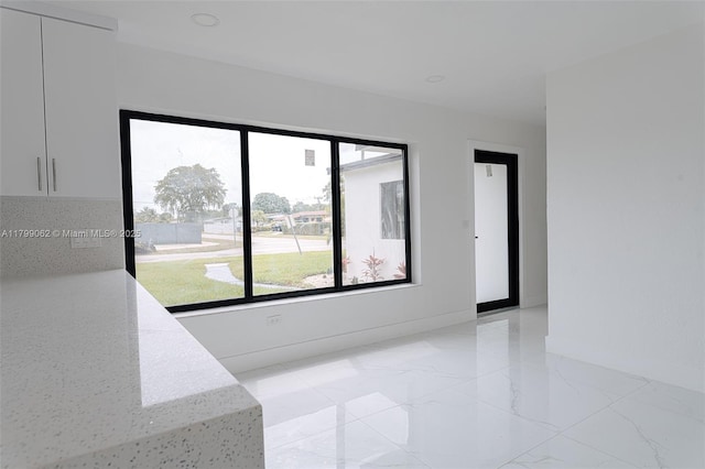 17940 NW 13th Ct, Miami Gardens, FL 33169 - unfurnished room with light marble finish floors and baseboards