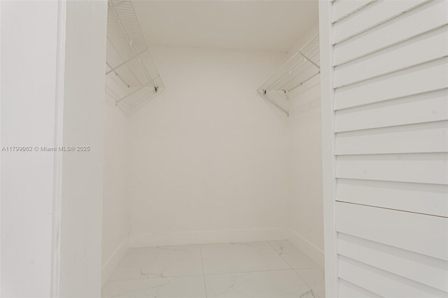 17940 NW 13th Ct, Miami Gardens, FL 33169 - spacious closet with light marble finish flooring