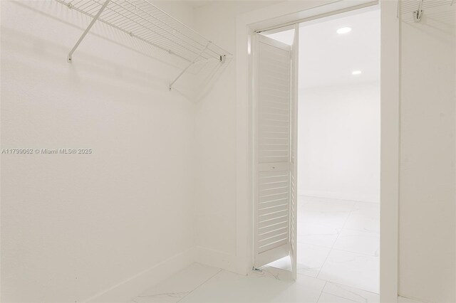 17940 NW 13th Ct, Miami Gardens, FL 33169 - walk in closet featuring light marble finish floors