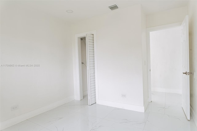 17940 NW 13th Ct, Miami Gardens, FL 33169 - empty room featuring light marble finish flooring and baseboards