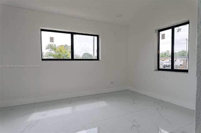 17940 NW 13th Ct, Miami Gardens, FL 33169 - unfurnished room featuring baseboards and marble look tile flooring