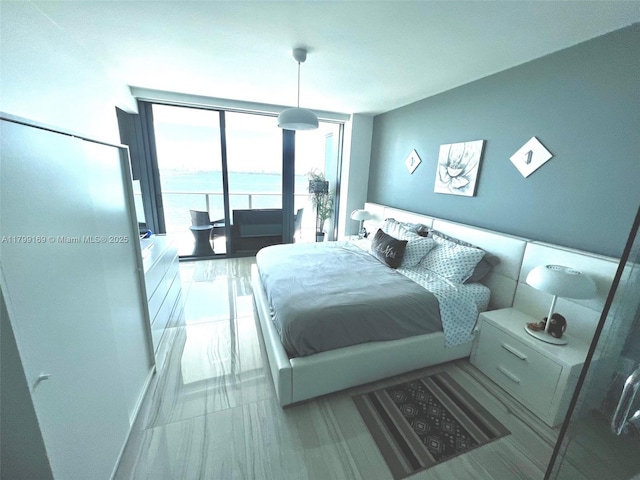 3131 NE 7th Ave Unit 1404, Miami, FL 33137 - bedroom featuring a wall of windows