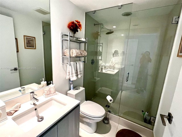 3131 NE 7th Ave Unit 1404, Miami, FL 33137 - bathroom with a shower stall, toilet, vanity, and tile patterned floors