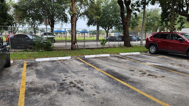 1810 W 56th St Unit 3420, Hialeah, FL 33012 - uncovered parking lot with fence