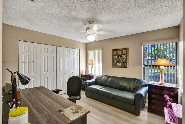 1930 W Oak Knoll Cir, Davie, FL 33324 - office space featuring wood finished floors, a ceiling fan, and a textured ceiling