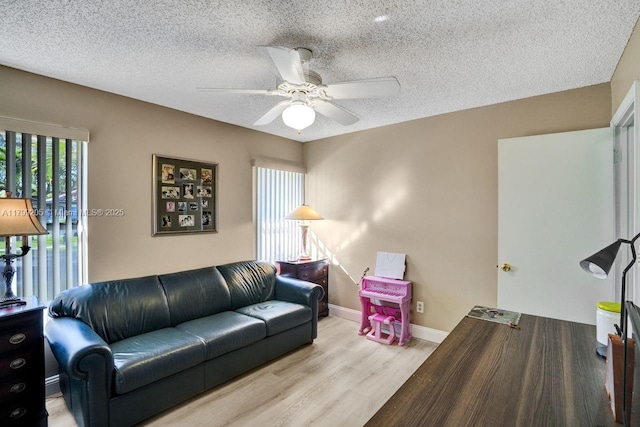 1930 W Oak Knoll Cir, Davie, FL 33324 - living area with ceiling fan, wood finished floors, a textured ceiling, and baseboards