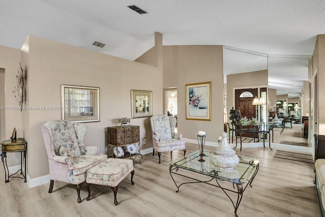 1930 W Oak Knoll Cir, Davie, FL 33324 - living area with wood finished floors, vaulted ceiling, and baseboards